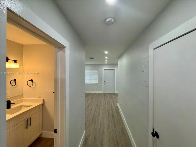 a bathroom with a sink and mirror