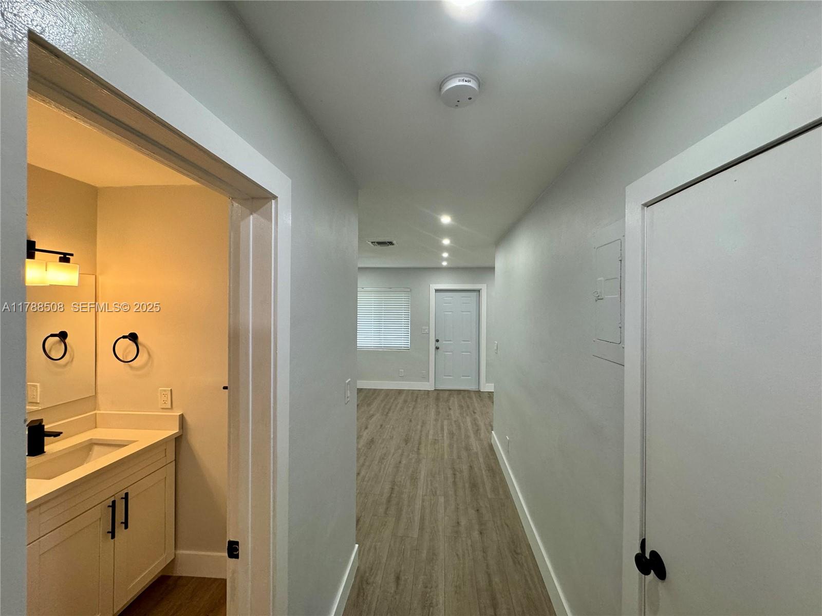 2631 Southwest 13th Avenue Fort Lauderdale, FL 33315 - Photo 6 of 24 a bathroom with a sink and mirror