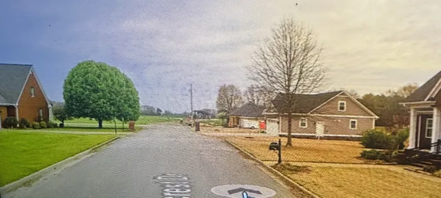 a view of a street in front of a building