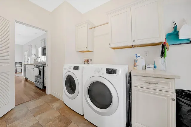 a bathroom with a sink a bathtub and a mirror