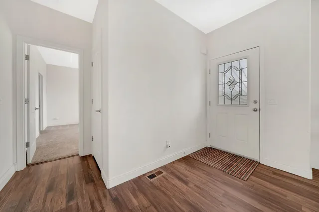 a bedroom with a bed and a chair