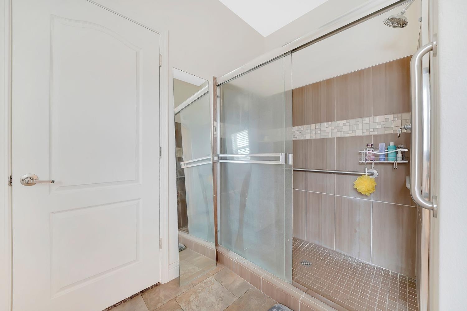 3745 Paramae Road Rail Road Flat, CA 95245 - Photo 30 of 95 a bathroom with a glass shower door