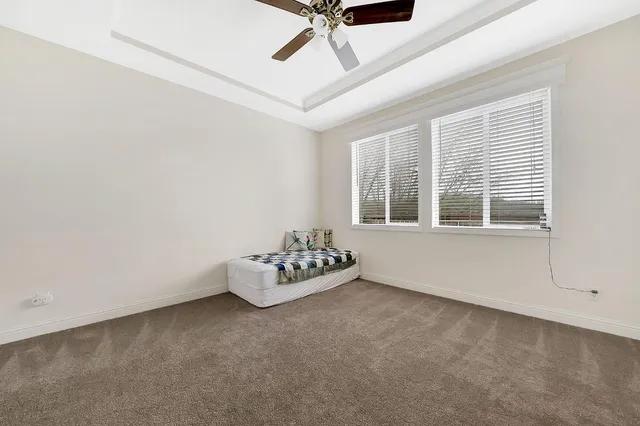 a kitchen with appliances a refrigerator and cabinets