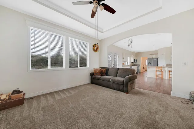 a living room with furniture and a window