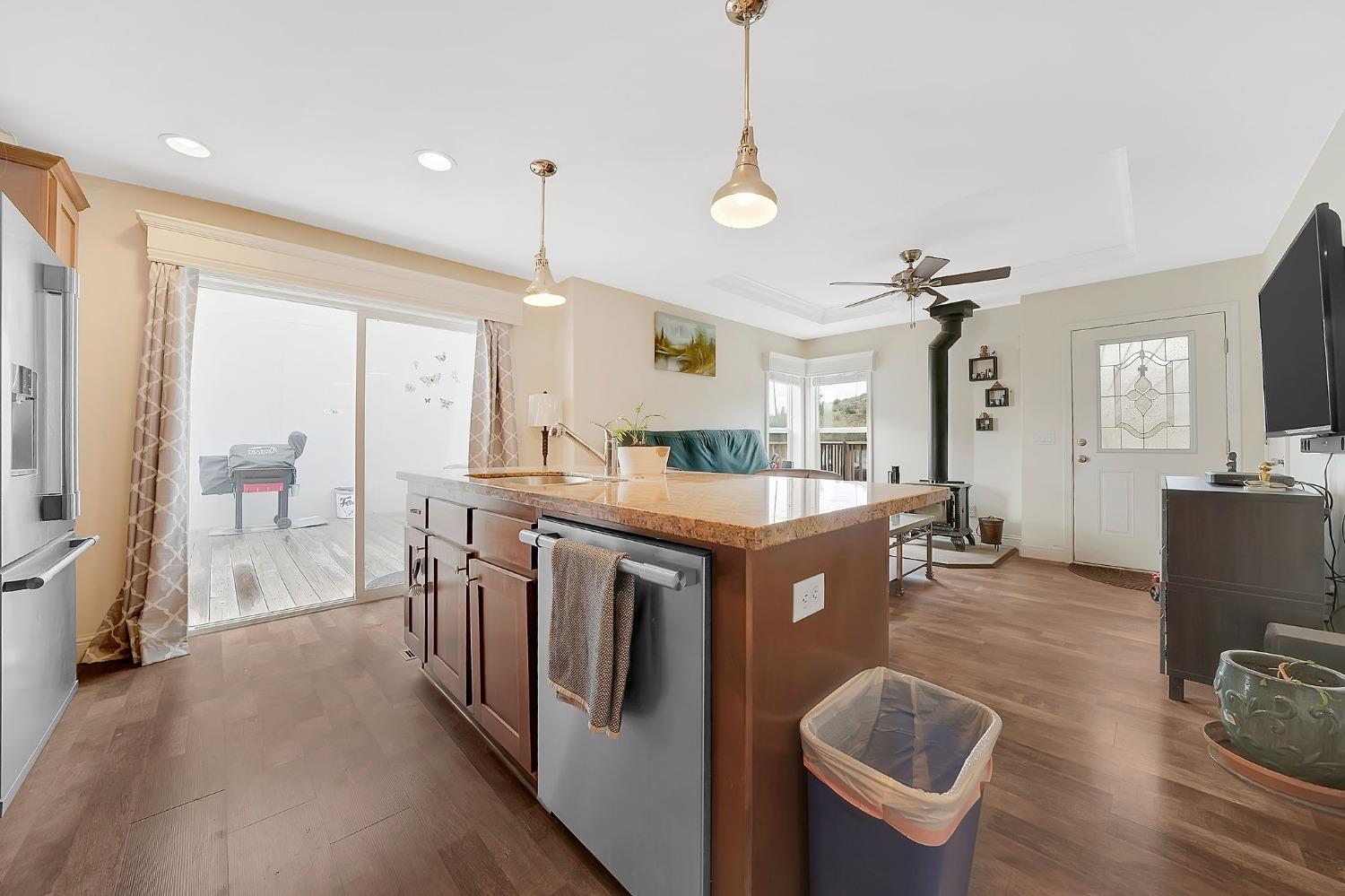 3745 Paramae Road Rail Road Flat, CA 95245 - Photo 55 of 95 a kitchen with stainless steel appliances granite countertop a sink a stove and a refrigerator