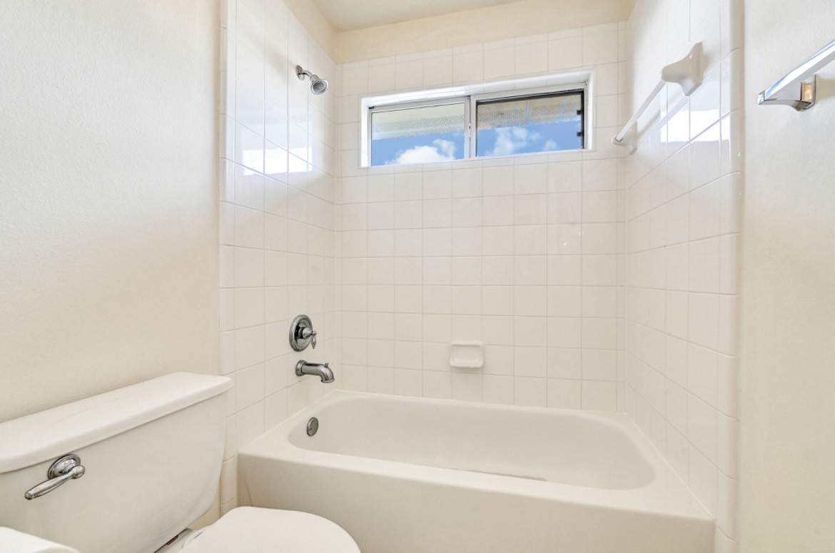 3306 Colleville Sur Mer Lane Spring, TX 77388 - Photo 27 of 40 a bathroom with a bathtub and a toilet