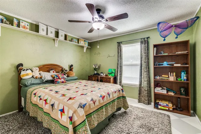 a bedroom with a bed and dresser