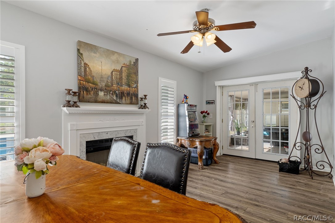 1140 South Highlands Avenue Inverness, FL 34452 - Photo 21 of 54 a bedroom with furniture a fireplace and wooden floor