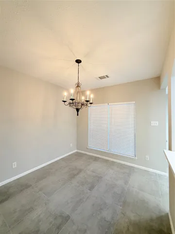 a view of a room with a hanging light