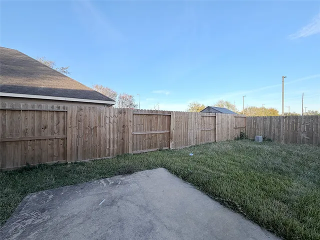 a view of a back yard of the house