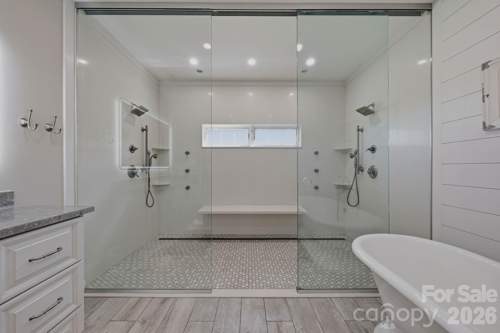 605 Recore Rdg Road Bessemer City, NC 28016 - Photo 18 of 47 a bathroom with a tub shower sink and mirror