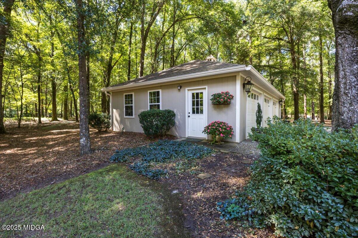 11 River Trace Macon, GA 31210 - Photo 19 of 61 a view of a house with yard and a garden