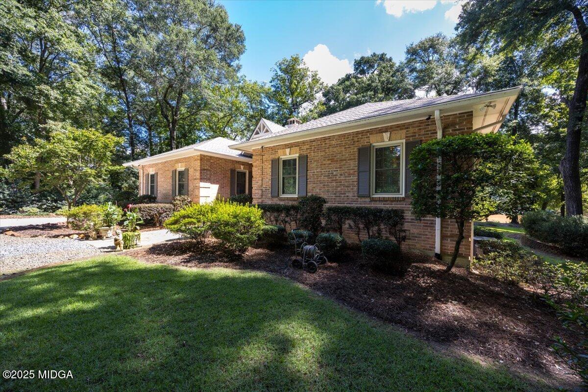11 River Trace Macon, GA 31210 - Photo 3 of 61 a view of a house with a backyard and a patio