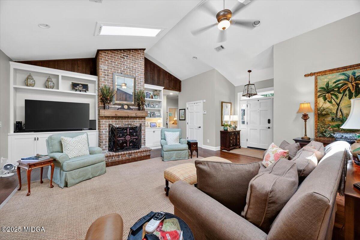 11 River Trace Macon, GA 31210 - Photo 37 of 61 a living room with furniture a flat screen tv and a fireplace