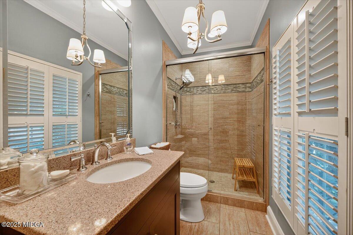 11 River Trace Macon, GA 31210 - Photo 46 of 61 a bathroom with a granite countertop sink a toilet a mirror and shower