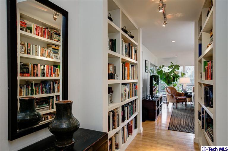 385 Manford Way Pasadena, CA 91105 - Photo 16 of 44 a living room with lots of furniture and a book shelf