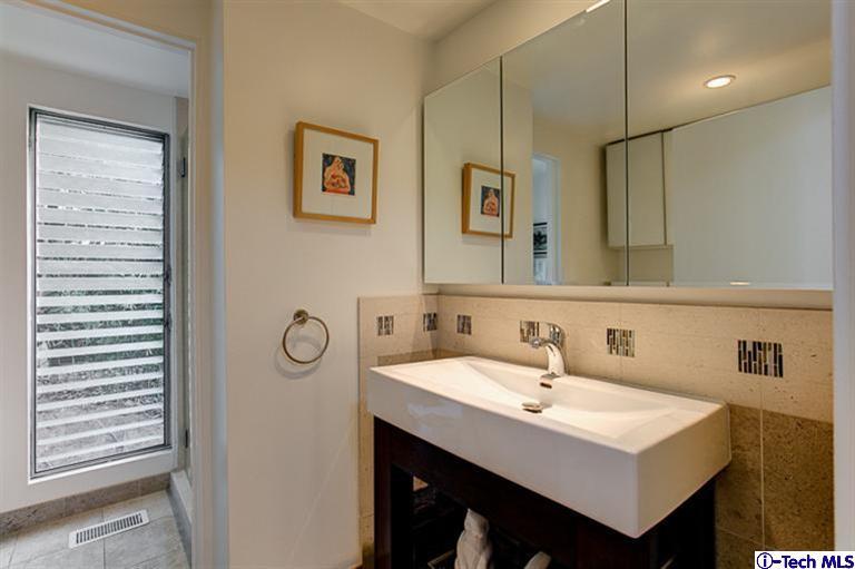 385 Manford Way Pasadena, CA 91105 - Photo 19 of 44 a white sink sitting under a bathroom mirror
