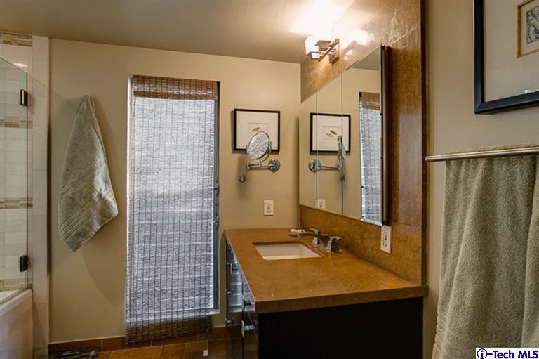 385 Manford Way Pasadena, CA 91105 - Photo 23 of 44 a bathroom with a sink and a mirror