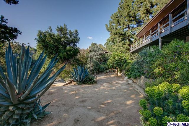 a view of a backyard with sitting area