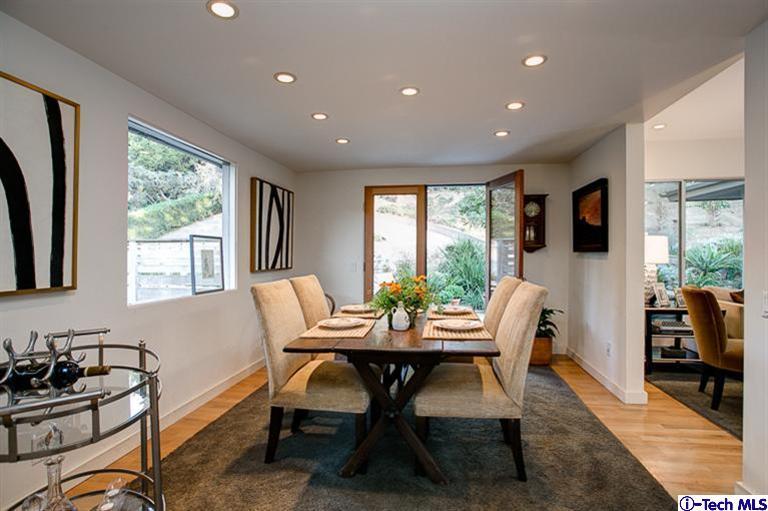 385 Manford Way Pasadena, CA 91105 - Photo 7 of 44 a dining room with furniture a window and a flat screen tv