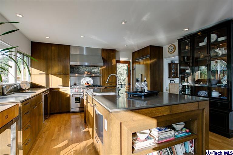 385 Manford Way Pasadena, CA 91105 - Photo 10 of 44 a kitchen with stainless steel appliances granite countertop sink stove and refrigerator