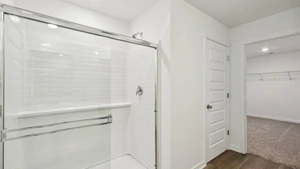 a bathroom with double sink and a mirror
