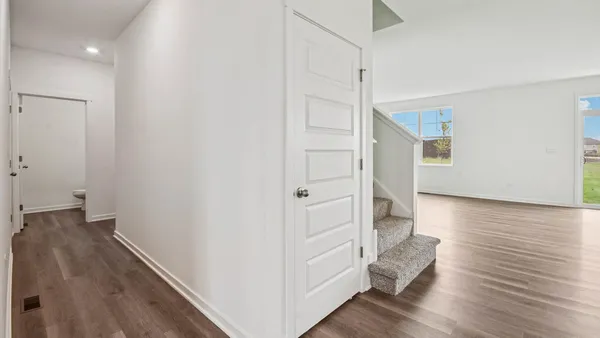 a view of entryway with wooden floor