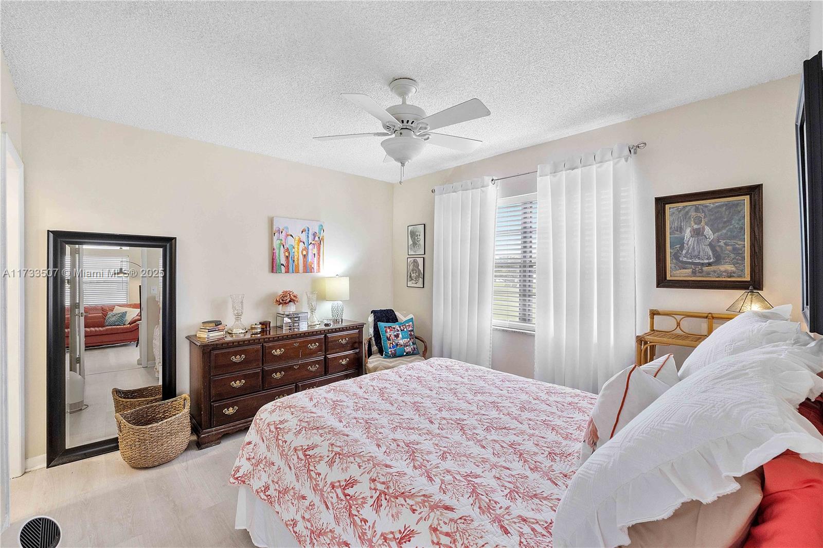 2751 East Golf Boulevard, Unit 2029 Pompano Beach, FL 33064 - Photo 12 of 24 a bedroom with a bed and dresser