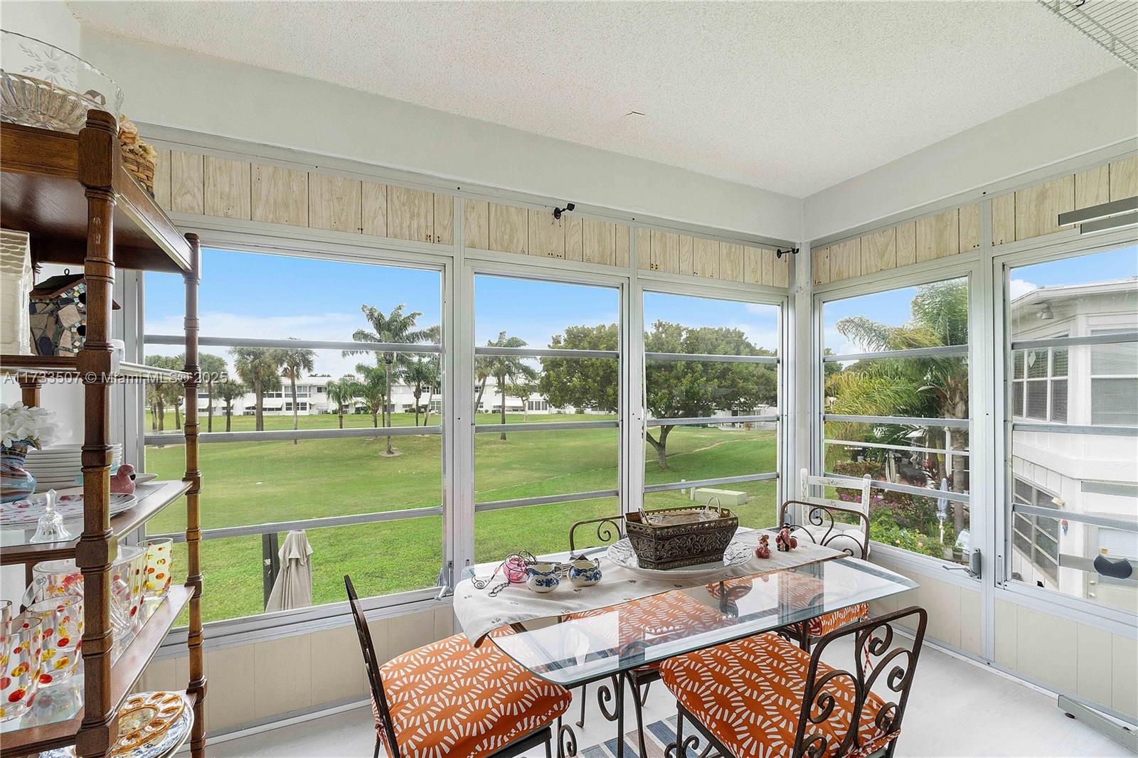 2751 East Golf Boulevard, Unit 2029 Pompano Beach, FL 33064 - Photo 2 of 24 a view of a dining room with furniture window and outside view
