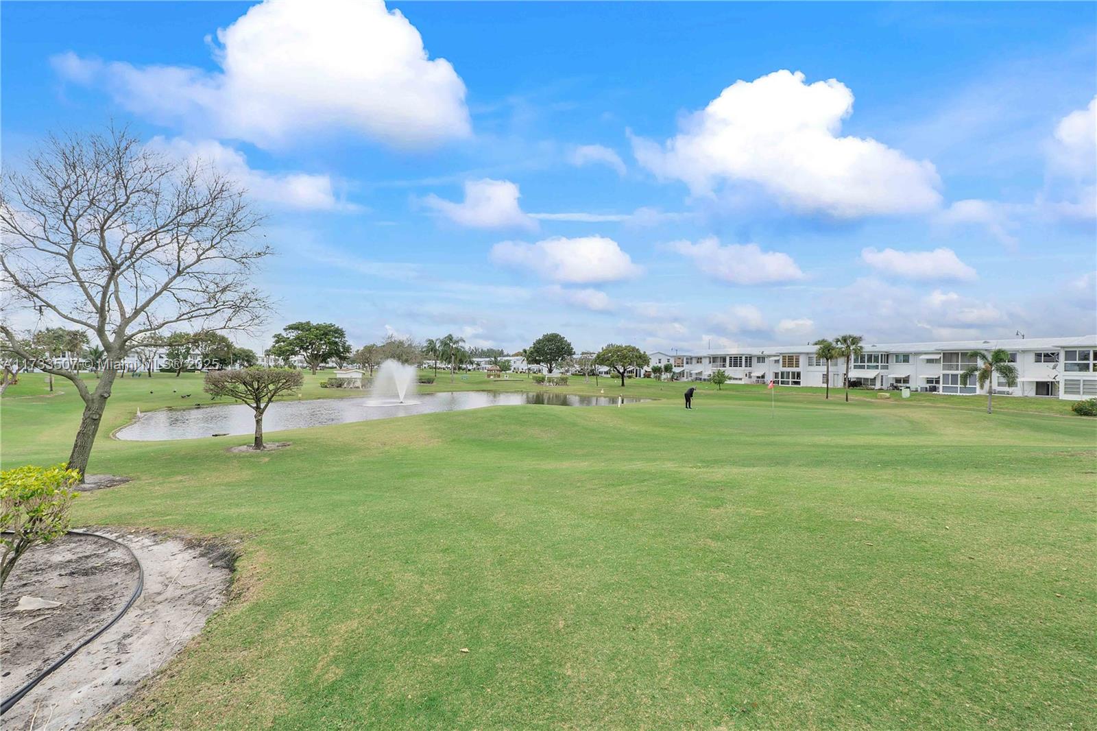 2751 East Golf Boulevard, Unit 2029 Pompano Beach, FL 33064 - Photo 21 of 24 a view of a green field