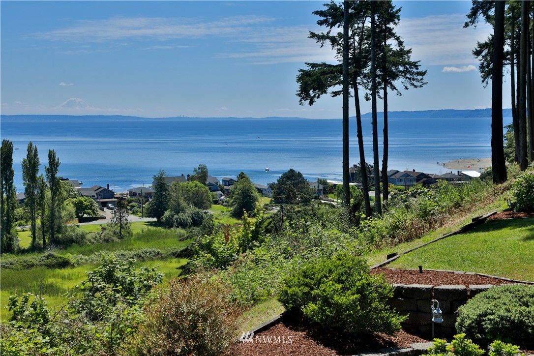 6188 Double Bluff Road Freeland, WA 98249 - Photo 1 of 40 a view of a garden with a tree