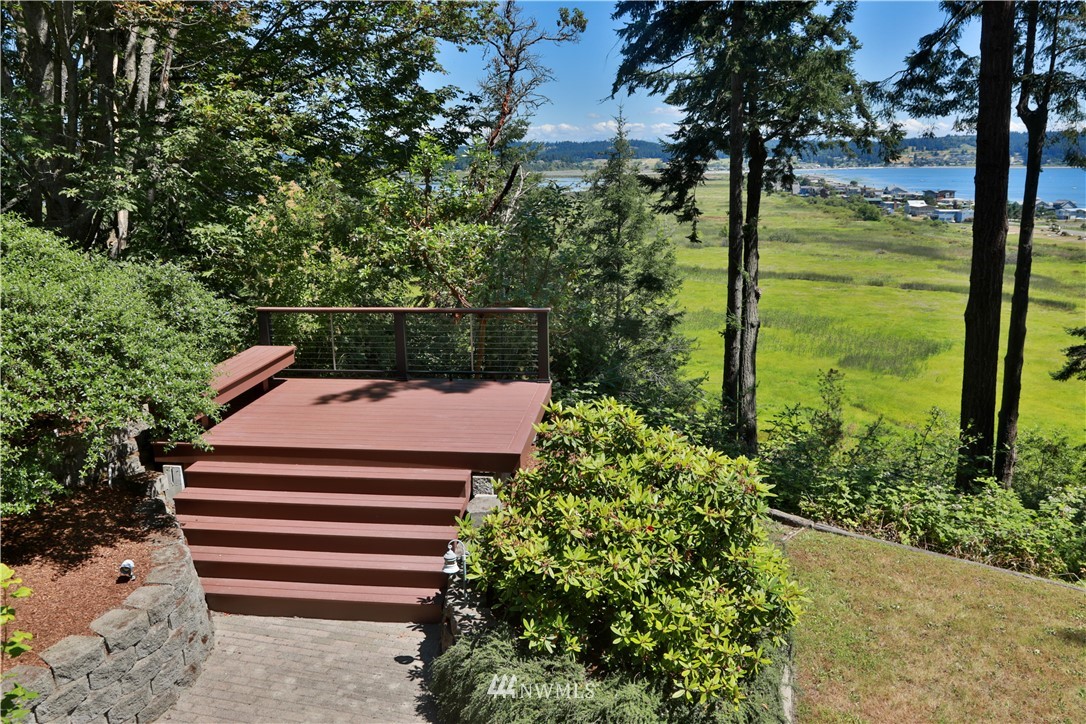 6188 Double Bluff Road Freeland, WA 98249 - Photo 18 of 40 a view of a garden with plants and large trees