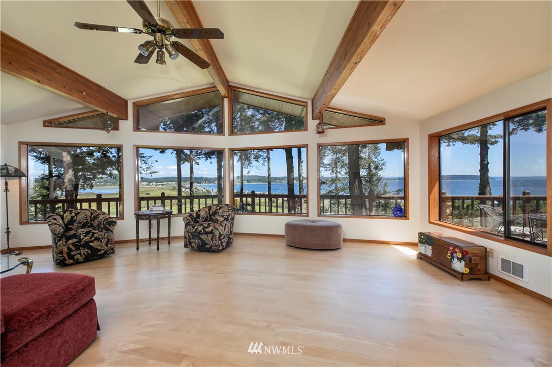 6188 Double Bluff Road Freeland, WA 98249 - Photo 19 of 40 a room with gym equipment and large windows