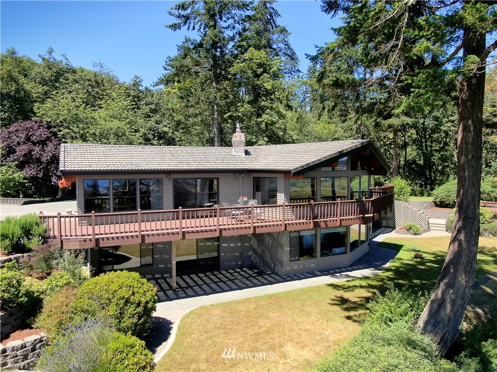 6188 Double Bluff Road Freeland, WA 98249 - Photo 3 of 40 a view of house and outdoor space with swimming pool