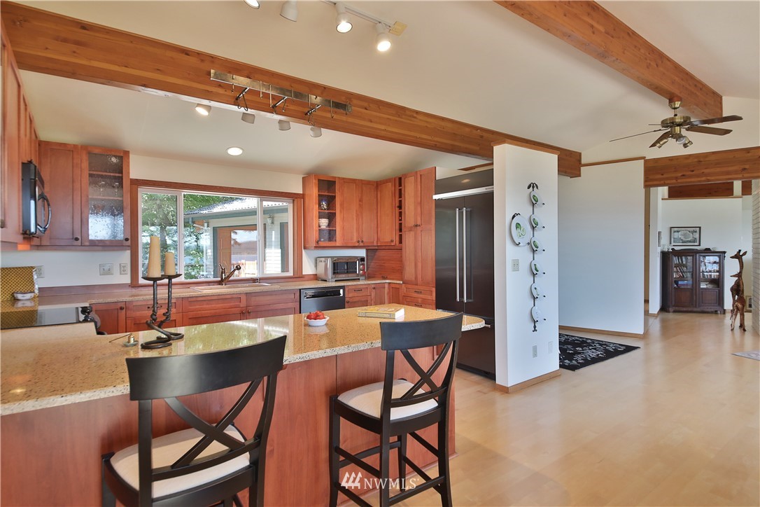6188 Double Bluff Road Freeland, WA 98249 - Photo 24 of 40 a dining room with furniture and window
