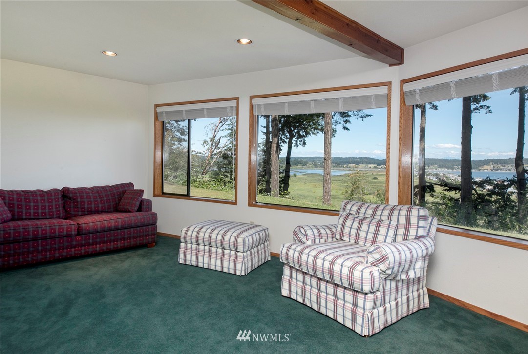 6188 Double Bluff Road Freeland, WA 98249 - Photo 34 of 40 a living room with furniture and a large window