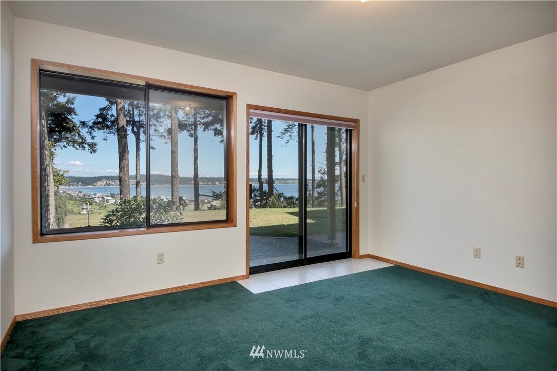 6188 Double Bluff Road Freeland, WA 98249 - Photo 36 of 40 an empty room with a large window