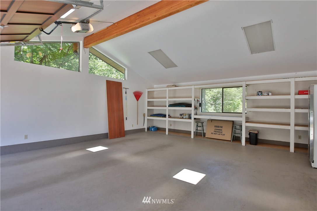 6188 Double Bluff Road Freeland, WA 98249 - Photo 37 of 40 a view of a livingroom with furniture and a window