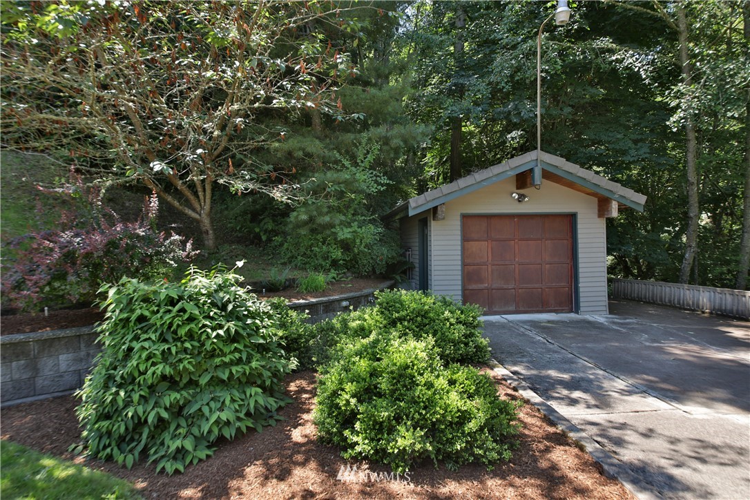 6188 Double Bluff Road Freeland, WA 98249 - Photo 39 of 40 a front view of a house with a garden