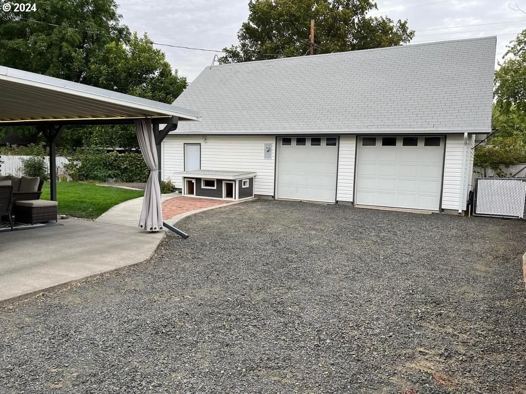 1516 Southwest 41st Street Pendleton, OR 97801 - Photo 14 of 20 a view of a house with backyard and a tree