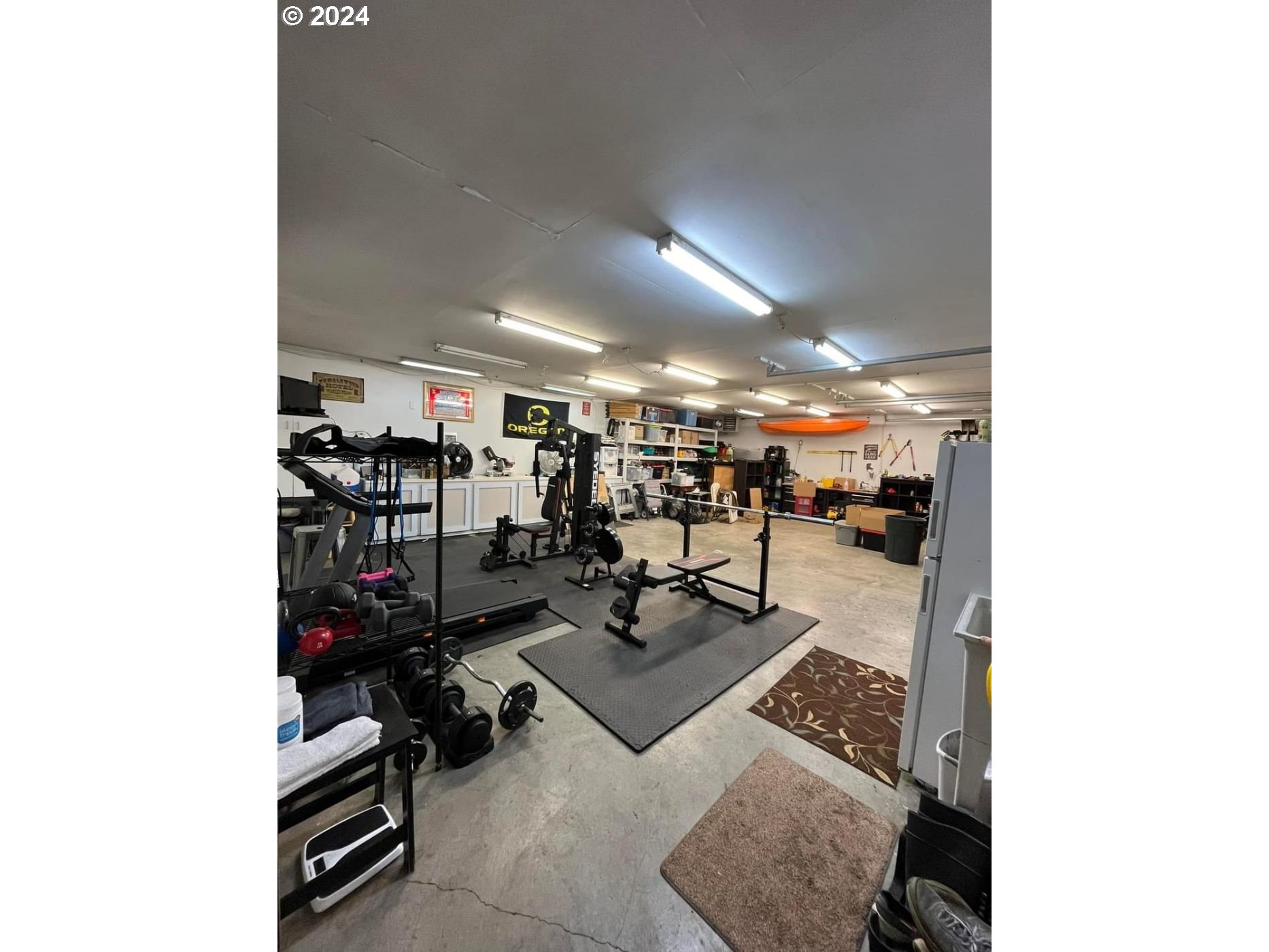 1516 Southwest 41st Street Pendleton, OR 97801 - Photo 17 of 20 a living room with lots of furniture and gym equipment