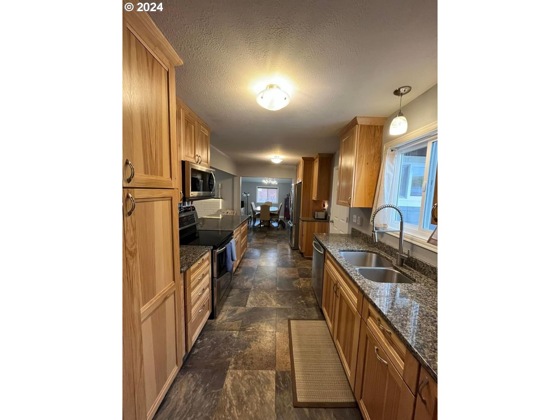 1516 Southwest 41st Street Pendleton, OR 97801 - Photo 4 of 20 a kitchen with stainless steel appliances granite countertop lots of counter top space