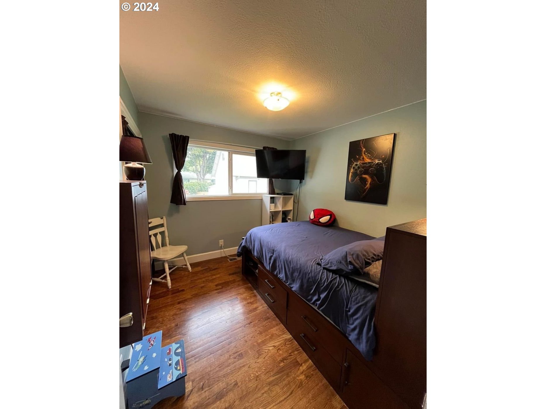 1516 Southwest 41st Street Pendleton, OR 97801 - Photo 6 of 20 a bed room with a bed and a tv