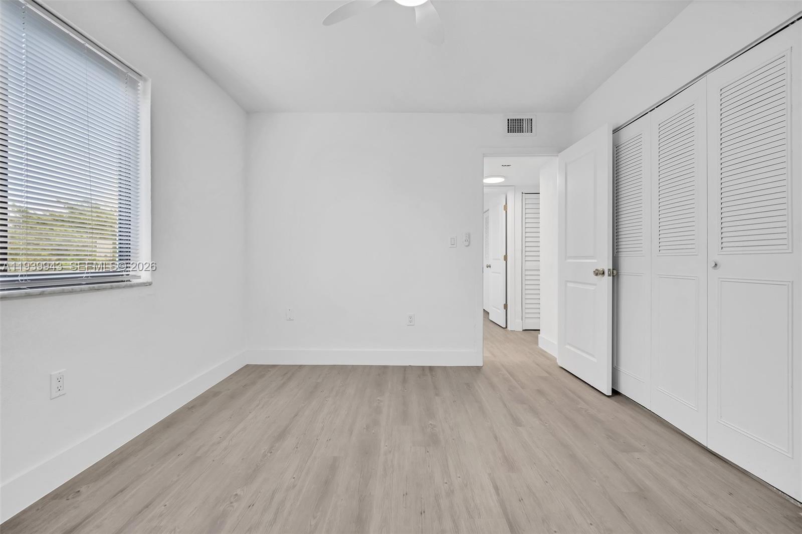 1530 Southwest 2nd Street, Unit 301 Miami, FL 33135 - Photo 2 of 12 a view of a room with wooden floor and window