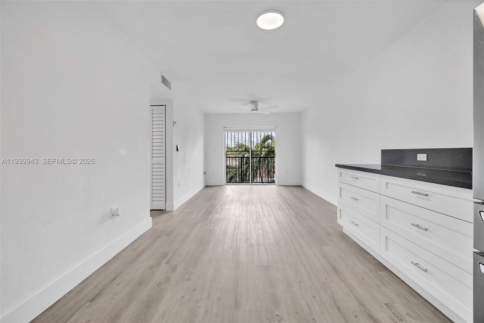 1530 Southwest 2nd Street, Unit 301 Miami, FL 33135 - Photo 4 of 12 a view of a livingroom with wooden floor