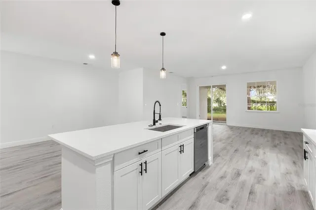 a kitchen with sink and window