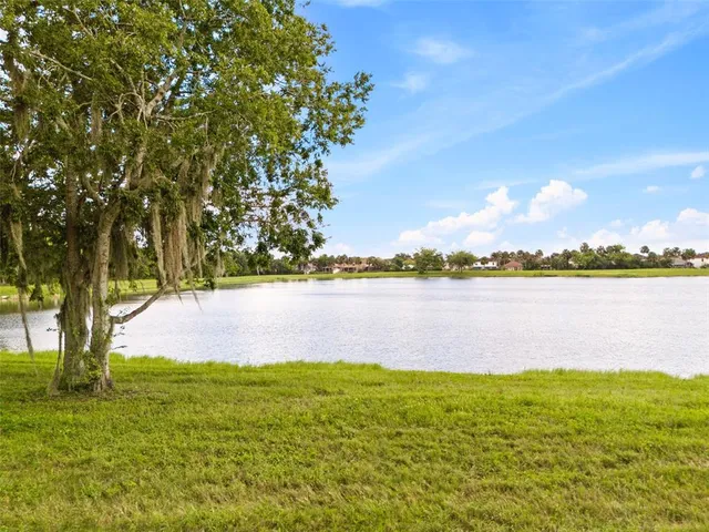 a view of a lake with a big yard