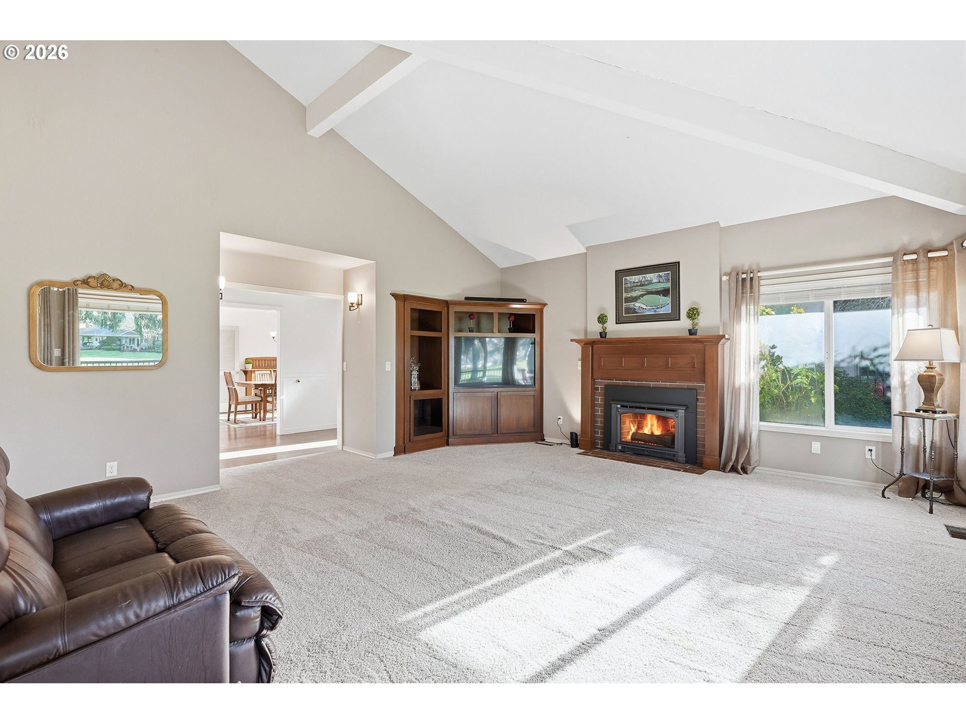 32565 Southwest Lake Point Court Wilsonville, OR 97070 - Photo 11 of 48 a living room with furniture and a fireplace