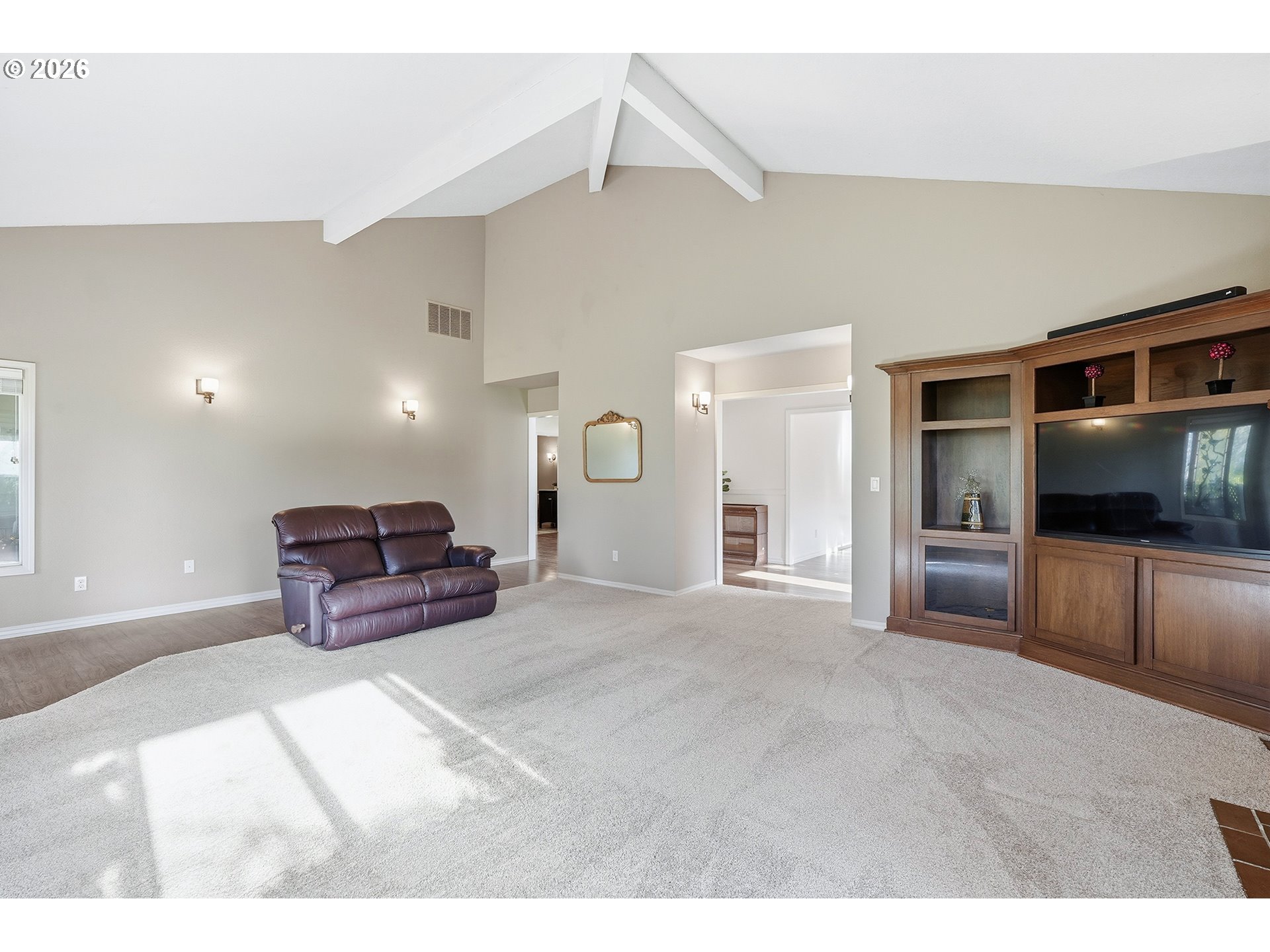 32565 Southwest Lake Point Court Wilsonville, OR 97070 - Photo 12 of 48 a spacious bedroom with a bed and a television in it