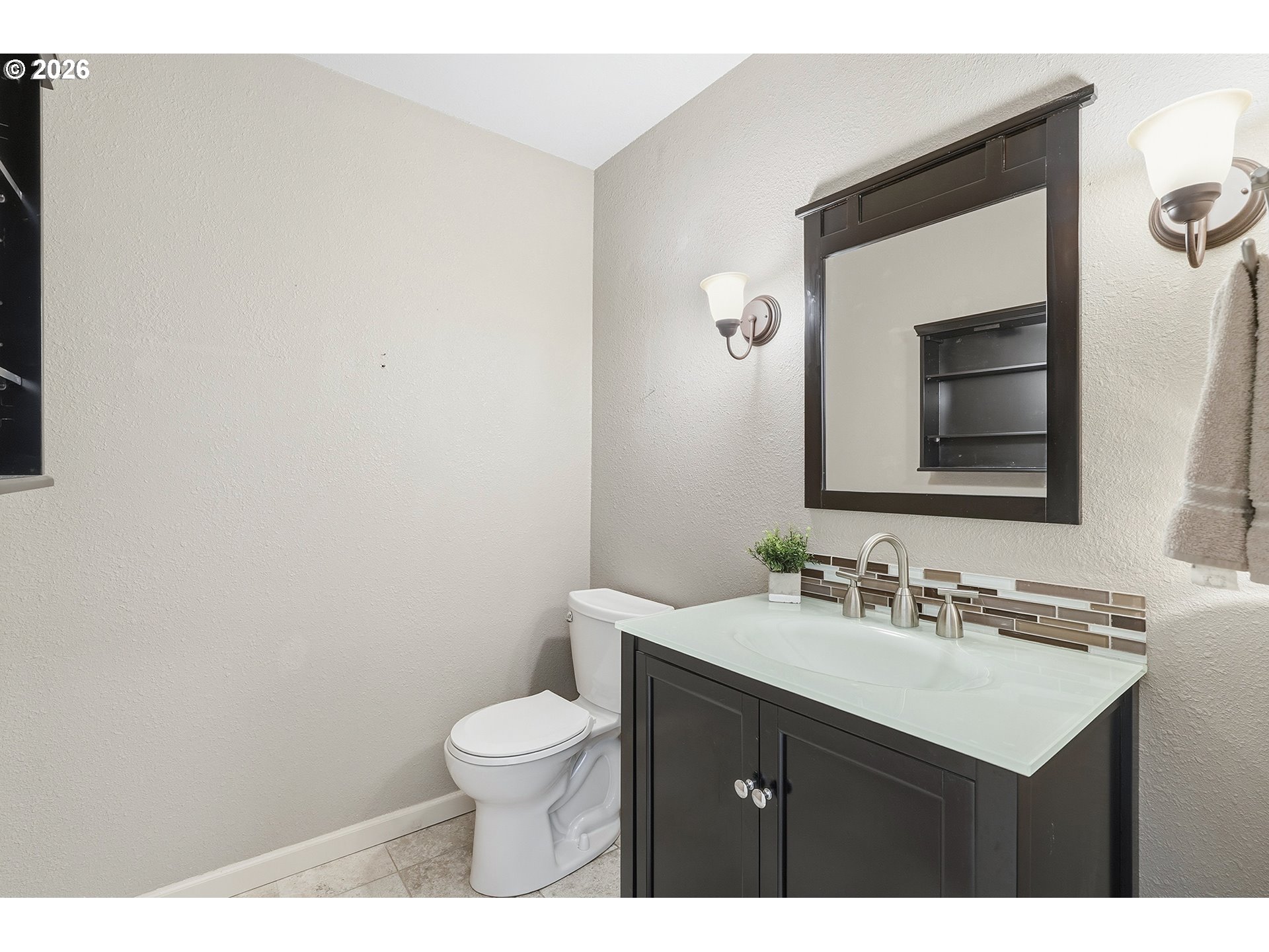 32565 Southwest Lake Point Court Wilsonville, OR 97070 - Photo 27 of 48 a bathroom with a toilet sink vanity and mirror